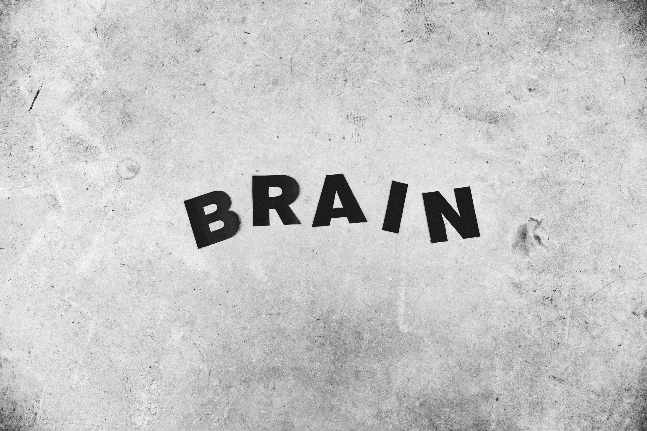 Background of Brain inscription on rugged wall